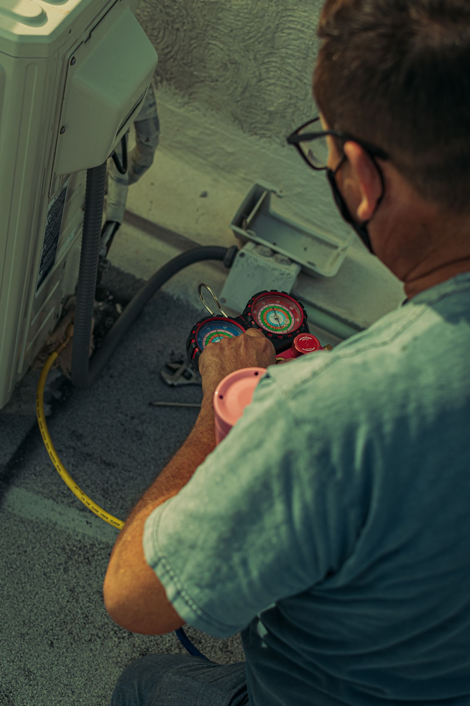 NS Mechanical technician servicing an outdoor HVAC unit