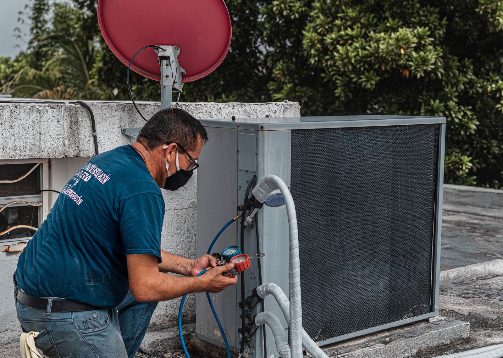 Technician checking a residential air conditioning unit